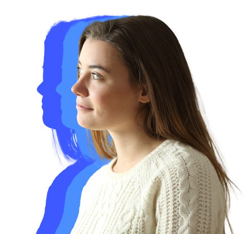 A Woman In A Sweater Gazes Away From The Camera, Softly Lit By Natural Light.